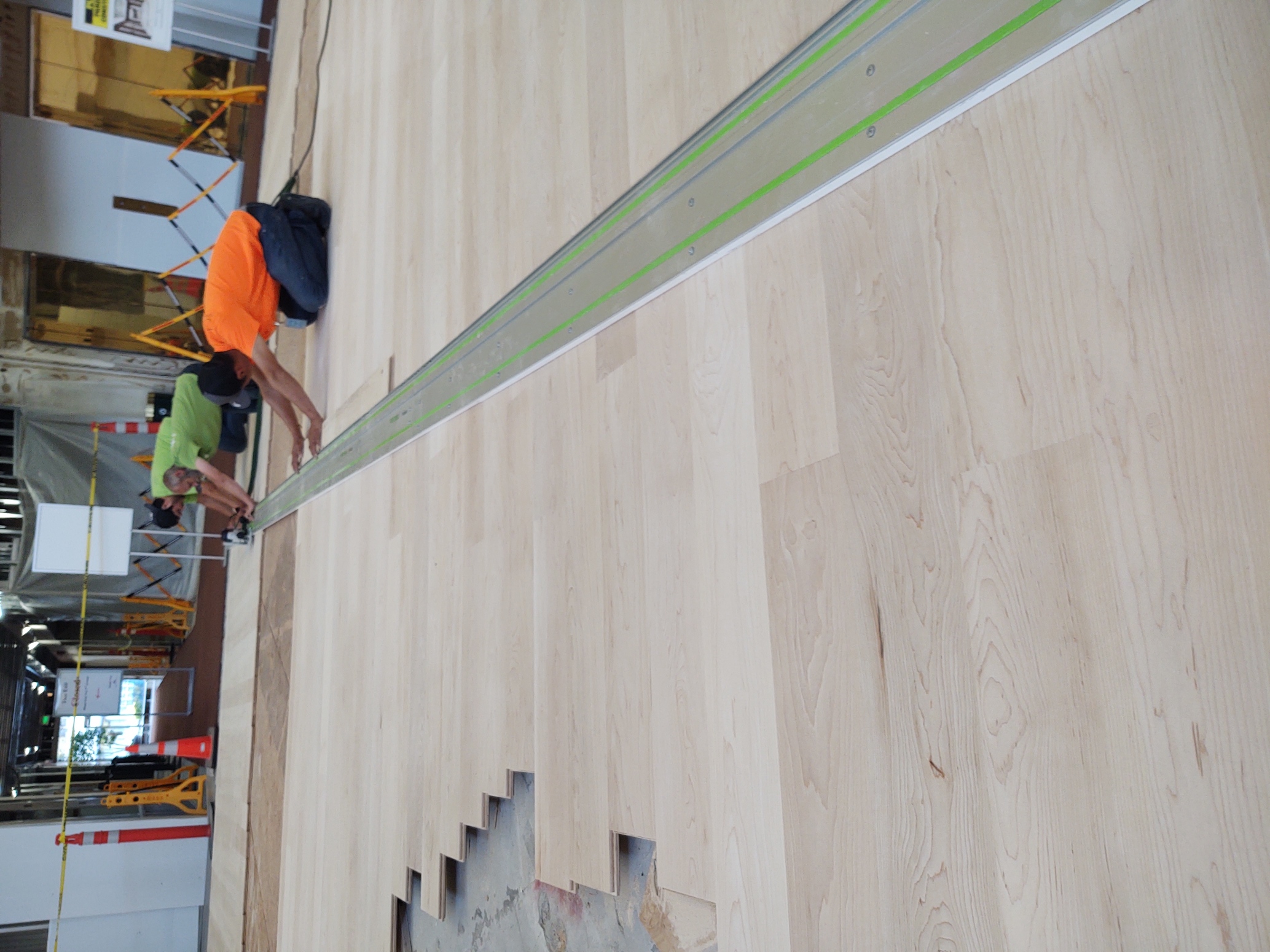 D-Lux Hardwood Floors crew working on the BOA Lobby Rotunda project