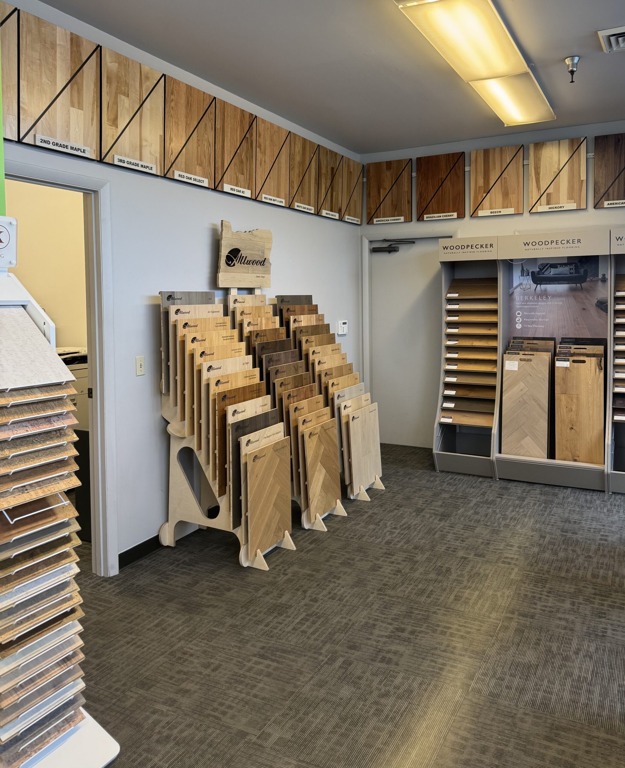 D-Lux Hardwood Floors showroom interior with flooring sample displays